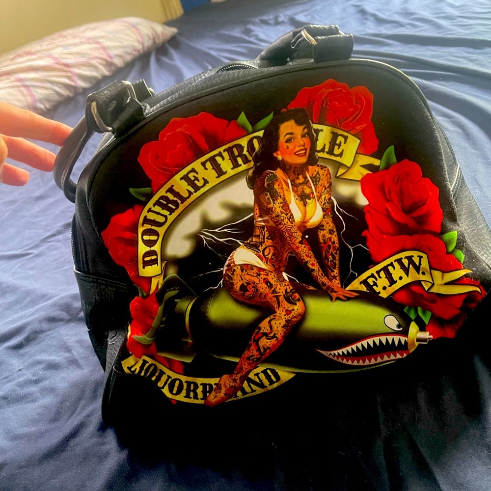 Purse with sexy tattooed girl
